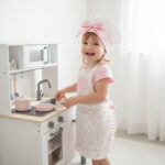 Kecelja za devojčice (Bela sa rozim tufnama)